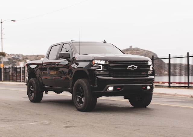 Do you really need a truck bed liner? - Photo of a black Chevy pickup truck driving on the road.