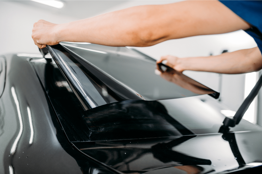 Car Window Tinting Near Las Vegas: Technician applying tint to a car window